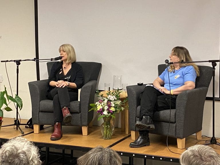 Frances (left) sitting onstage with author Cathalynn Labonté-Smith (right) at West Vancouver Memorial Library